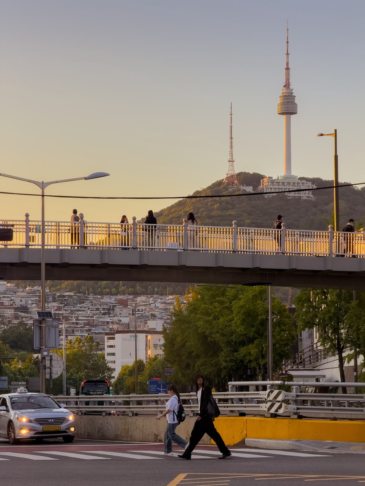 Seoul's skyline rises from mountain, river and infrastructure: a city where national ambition has been concentrated into one metropolitan frame.