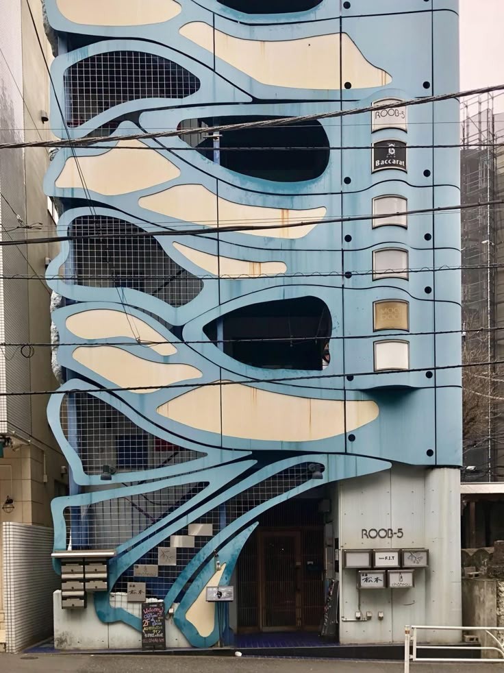 A pop-cultural urban surface: Tokyo buildings can behave like signs, characters and street-scale media.